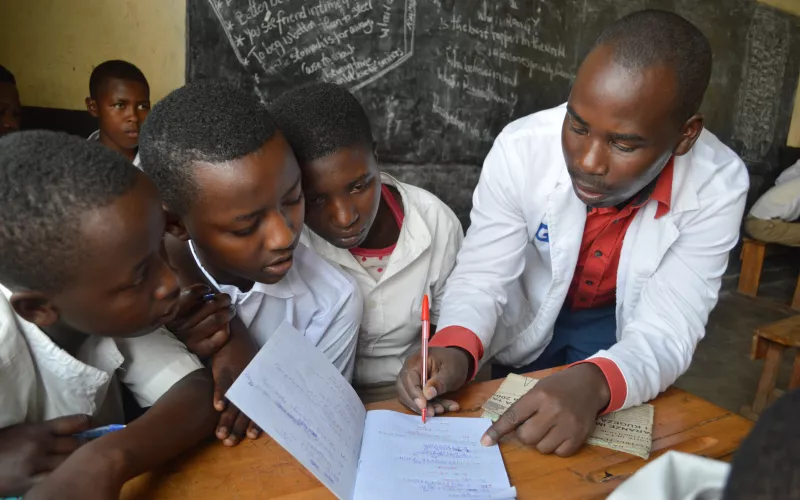 Men writing on notebook