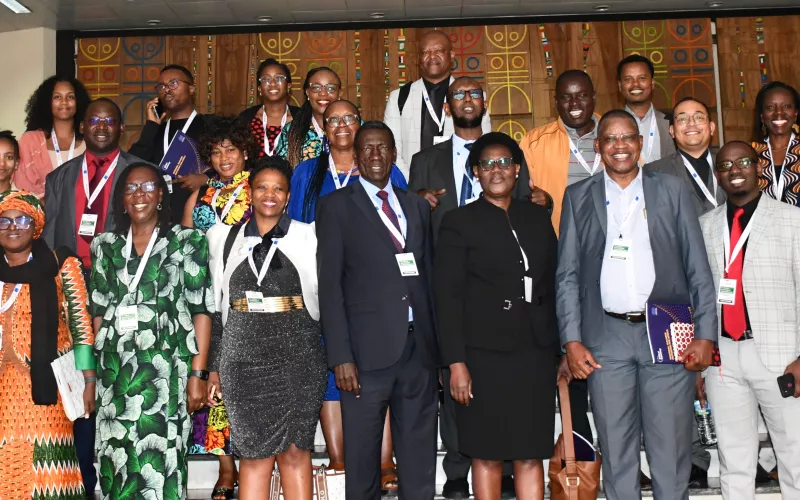 A group of people standing indoors.