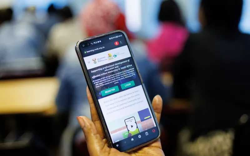 A hand holding a phone.