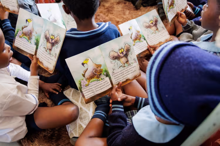 Preschool children in South Africa reading.