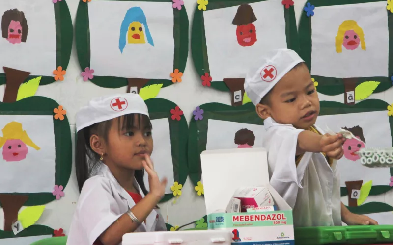 Children play in medical costumes