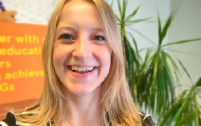 Naomi smiling at the camera