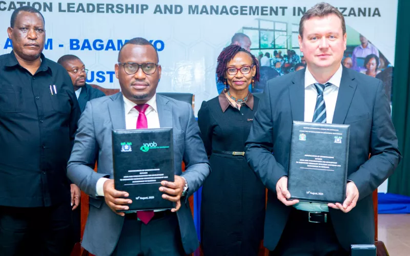 Colleauges from VVOB and ADEM pose for a signing agreement