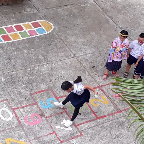 Chlidren playing hopscotch