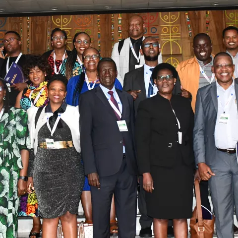 A group of people standing indoors.