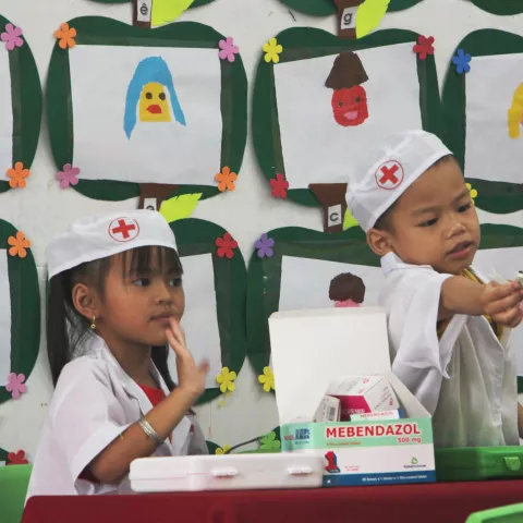 Children play in medical costumes