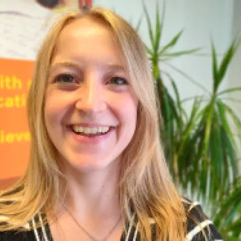 Naomi smiling at the camera